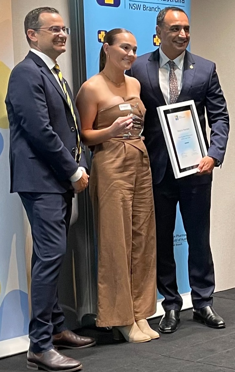 Jesyca Pearson (centre) receiving her award with Mario Barone (left) and Minister Singh Student Pharmacist of the Year Jesyca