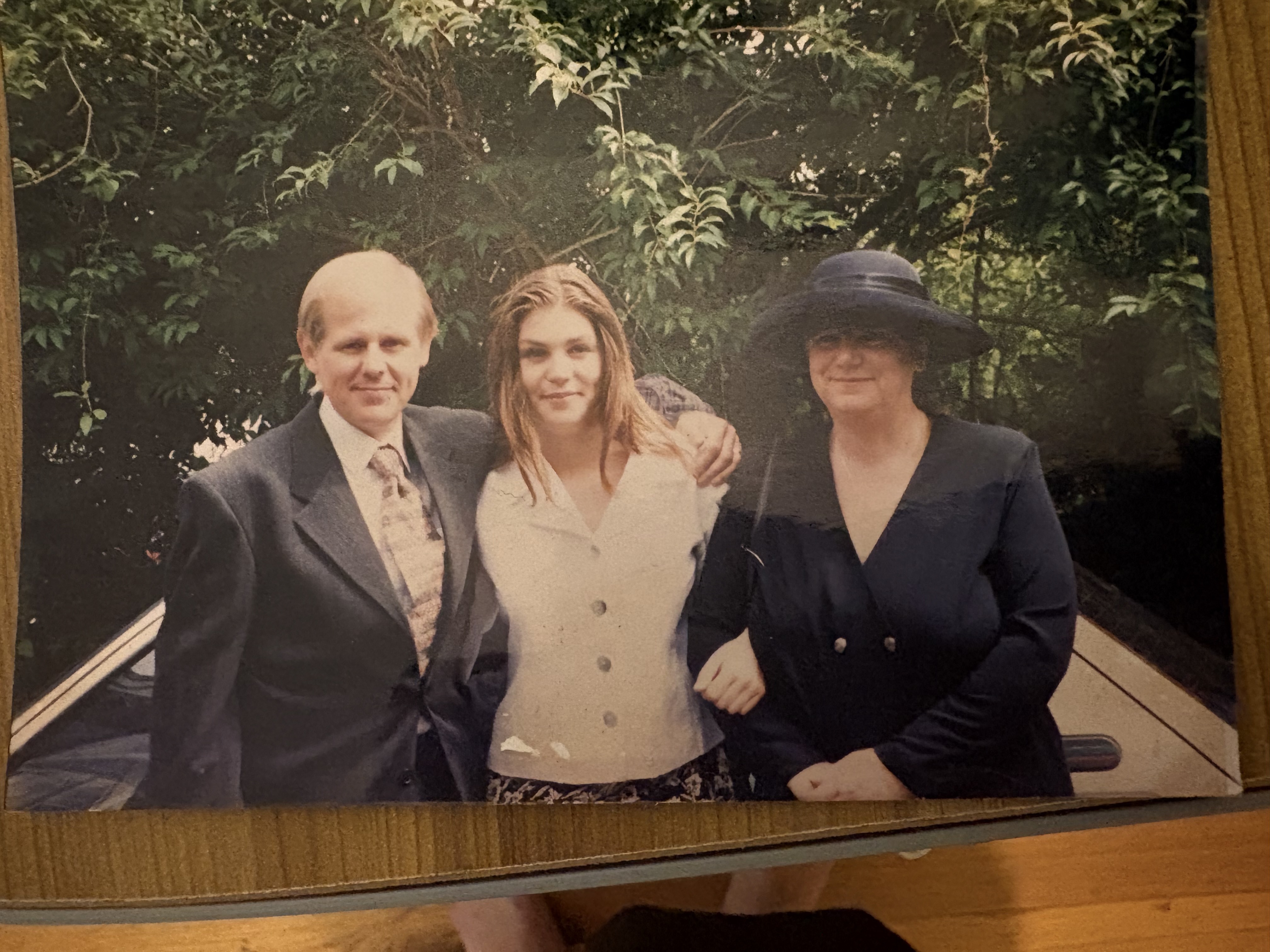 Victoria with her mother, Carol, and father, Peter, who owned two pharmacies just outside of London, in the UK